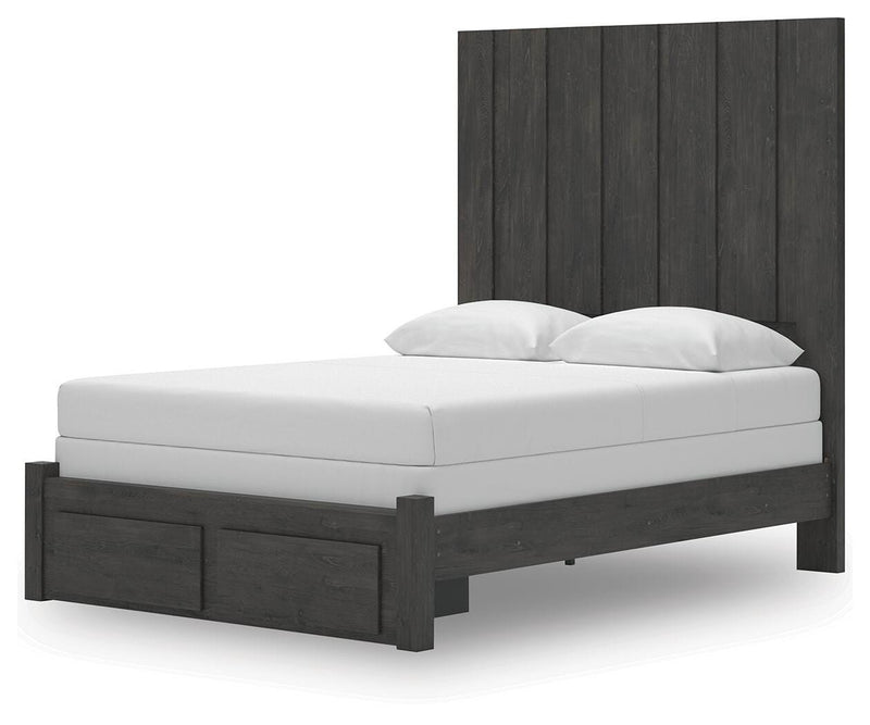 Ashley Furniture Fraluna bedroom set with a bed, nightstands, and dresser, shown from an angled view in a stylish bedroom setting.