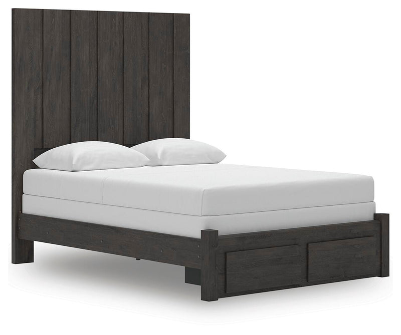 Ashley Furniture Fraluna bedroom set with a bed, nightstands, and dresser, shown from an angled perspective in a modern bedroom setting.