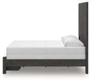 Ashley Furniture Fraluna bedroom set featuring a modern bed frame with matching nightstands and dresser in a stylish bedroom setting.