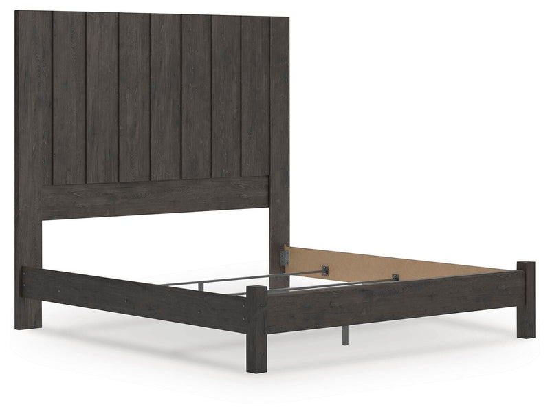 Ashley Furniture Fraluna bedroom set with a modern bed frame, matching nightstands, and a stylish dresser in a cozy bedroom scene.