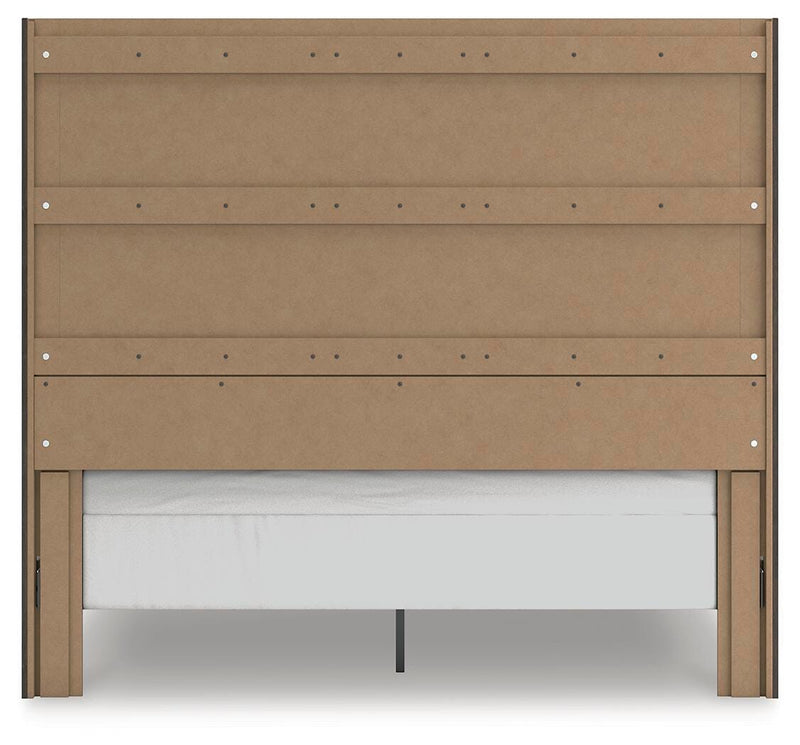 Ashley Furniture Fraluna bedroom set, showing the bed frame with a headboard and matching nightstands in a cozy bedroom setting