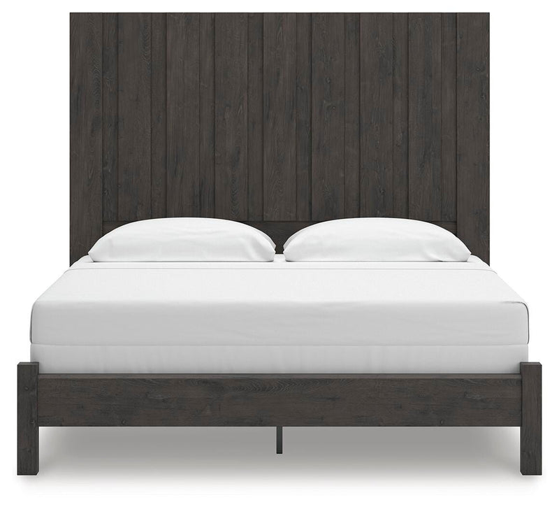 Ashley Furniture Fraluna bedroom set with a headboard, dresser, and nightstands shown in a modern bedroom scene.