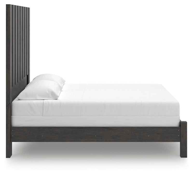 Ashley Furniture Fraluna bedroom set with a bed, nightstands, and dresser in a stylish, modern bedroom arrangement.