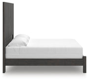 Ashley Furniture Fraluna bedroom set with a wooden bed frame, matching nightstands, and modern design elements.