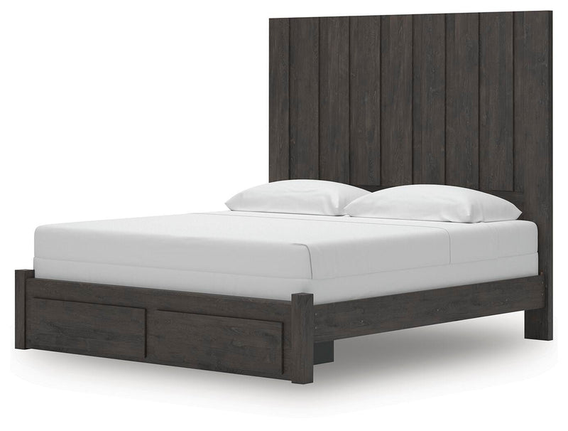 Ashley Furniture Fraluna bedroom set with a bed, nightstands, and dresser in a modern design, shown from an angled view.