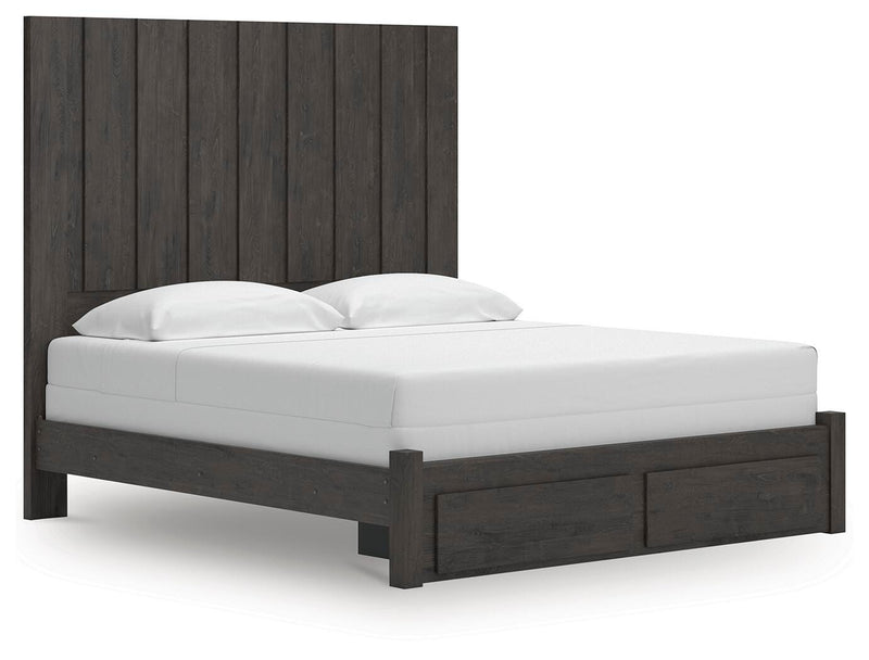 Ashley Furniture Fraluna bedroom set with a bed, nightstands, and dresser shown from an angled view in a stylish bedroom setup.