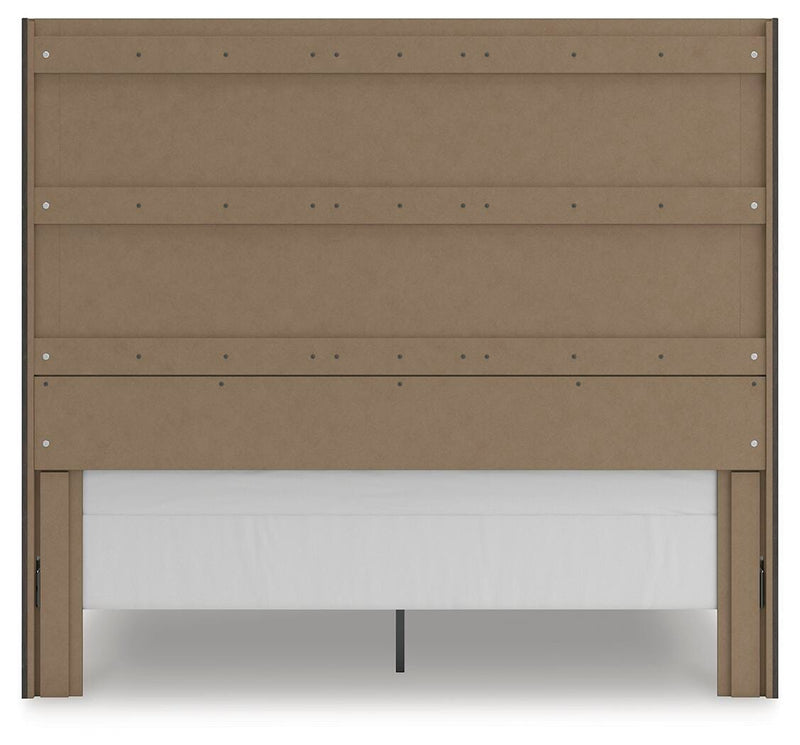 Ashley Furniture Fraluna bedroom set includes a bed, nightstands, and dresser with a modern design in a stylish bedroom scene.