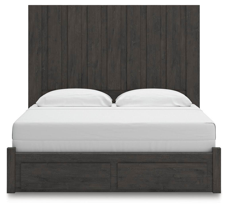 Ashley Furniture Fraluna bedroom set featuring a queen-sized bed with a tufted headboard and matching nightstands in a modern design.