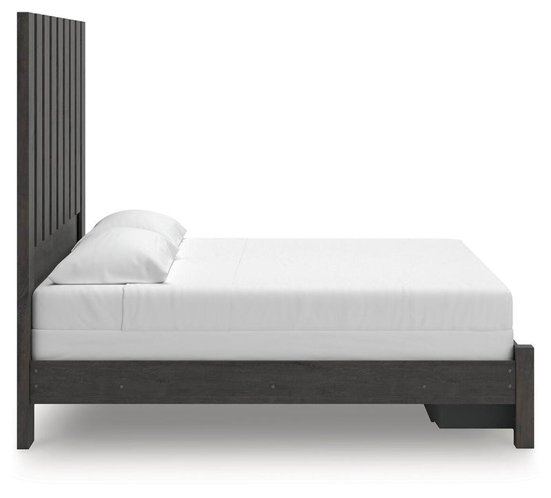 Ashley Furniture Fraluna bedroom set featuring a bed frame, matching nightstands, and a dresser in a modern bedroom layout.