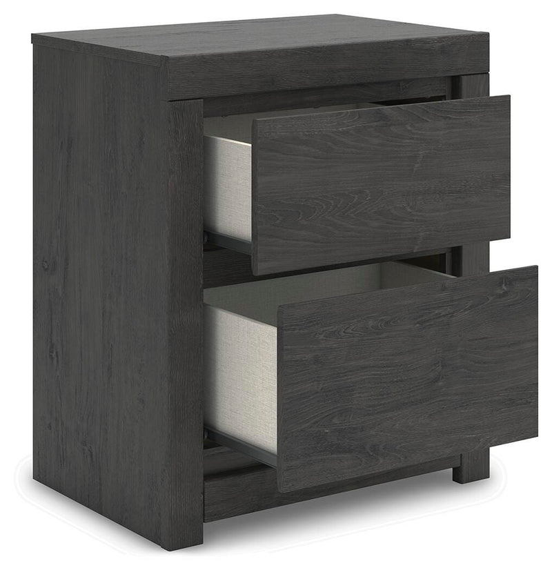 Ashley Furniture Fraluna bedroom set showing a modern bed frame with matching nightstands and a cozy, stylish bedroom interior.