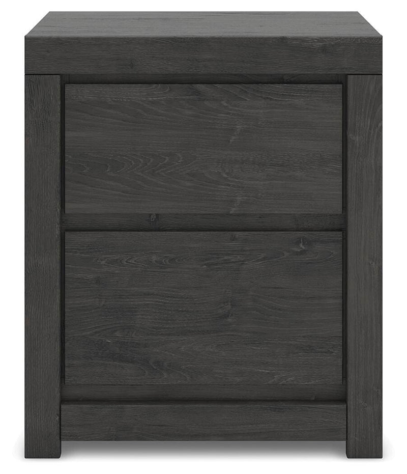 Ashley Furniture Fraluna bedroom set with a headboard, showcasing a modern wooden design in a cozy bedroom setting.