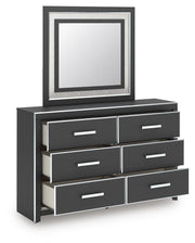 Ashley Furniture Zuraleus dresser and mirror set, showing the open dresser with mirror attached, in a modern bedroom setting.