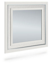 Ashley Furniture Zuraleus bedroom mirror shown from an angled side view, showcasing its sleek design and frame details.
