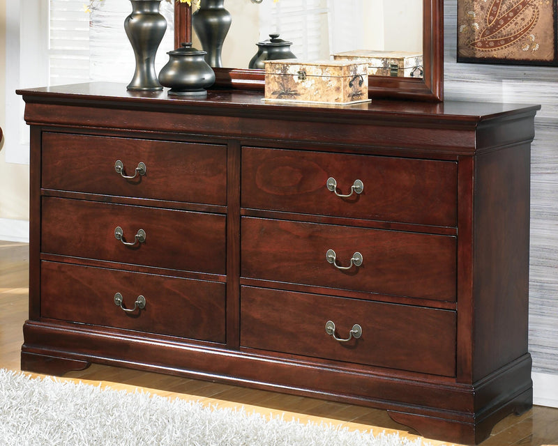 Alisdair dresser by Ashley Furniture featuring a modern wood finish with multiple drawers and sleek metal handles.