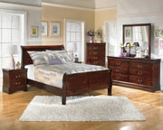 Ashley Furniture Alisdair Bedroom Set featuring a wooden bed frame, matching nightstands, and a dresser in a modern design.