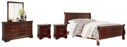Ashley Furniture Alisdair bedroom set with a bed, dresser, and nightstands in a warm wood finish, showcasing a modern bedroom design.