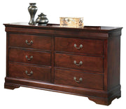 Ashley Furniture Alisdair dresser showing a modern wooden dresser with multiple drawers and sleek hardware.