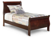 Ashley Furniture Alisdair Youth Bed with a sturdy wooden frame and clean design, suitable for a child's bedroom.