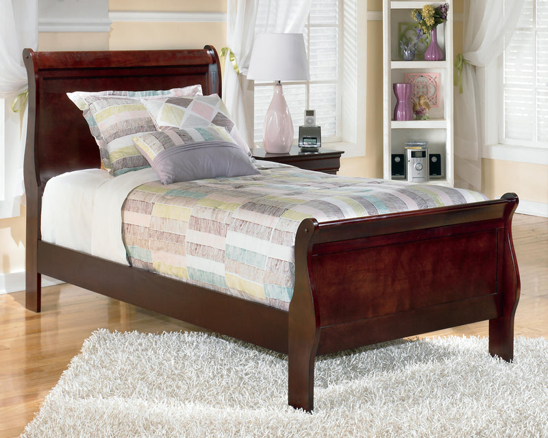 Ashley Furniture Alisdair bedroom set with a modern bed, matching nightstands, and coordinated dresser in a stylish bedroom scene.