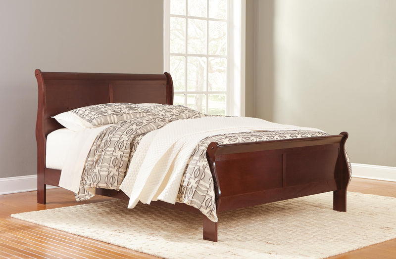 Ashley Furniture Alisdair Bed with a sturdy wooden frame and classic design, shown in a cozy bedroom setting.