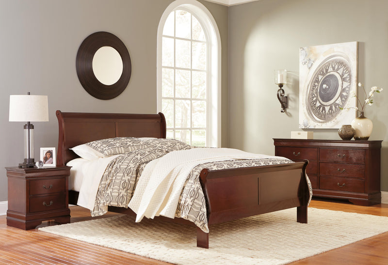 Ashley Furniture Alisdair bedroom set featuring a modern bed frame with matching nightstands and dresser in a stylish bedroom setup.