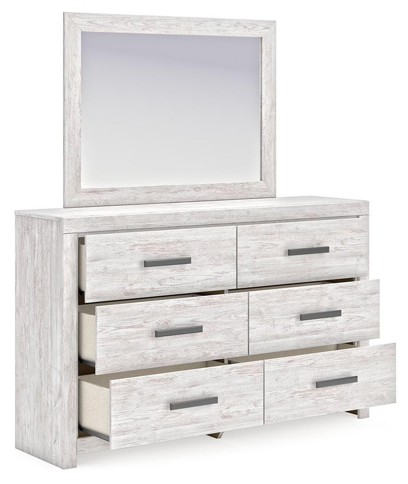 Ashley Furniture Cayboni bedroom set with a modern bed, nightstands, and dresser shown from an angled open view in a stylish bedroom.