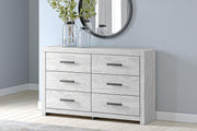 Ashley Furniture Cayboni dresser with dark wood finish and modern hardware, featuring multiple drawers for ample storage.
