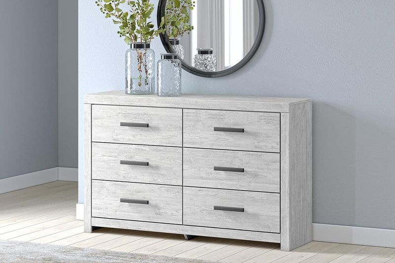 Ashley Furniture Cayboni dresser with dark wood finish and modern hardware, featuring multiple drawers for ample storage.