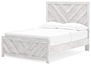 Ashley Furniture Cayboni bedroom set with a modern bed, nightstands, and dresser shown from an angled view.