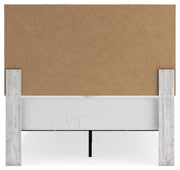 Ashley Furniture Cayboni bedroom set includes a bed, nightstands, and dresser in a modern bedroom design.
