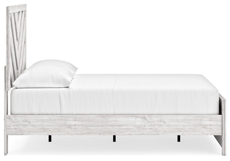 Ashley Furniture Cayboni bedroom set with a modern bed frame, matching nightstands, and dresser in a stylish bedroom scene.