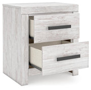 Ashley Furniture Cayboni bedroom set with bed, nightstands, and dresser in a modern bedroom arrangement.