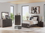 Ashley Furniture Prendonea nightstand with a sleek wood finish and modern design, featuring a single drawer and open shelf.