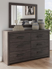 Ashley Furniture Prendonea dresser and mirror set, featuring a stylish wooden dresser with a matching mirror for bedroom decor.