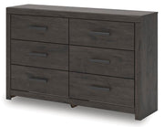 Ashley Furniture Prendonea dresser with a sleek, modern design, featuring multiple drawers and a warm wood finish.
