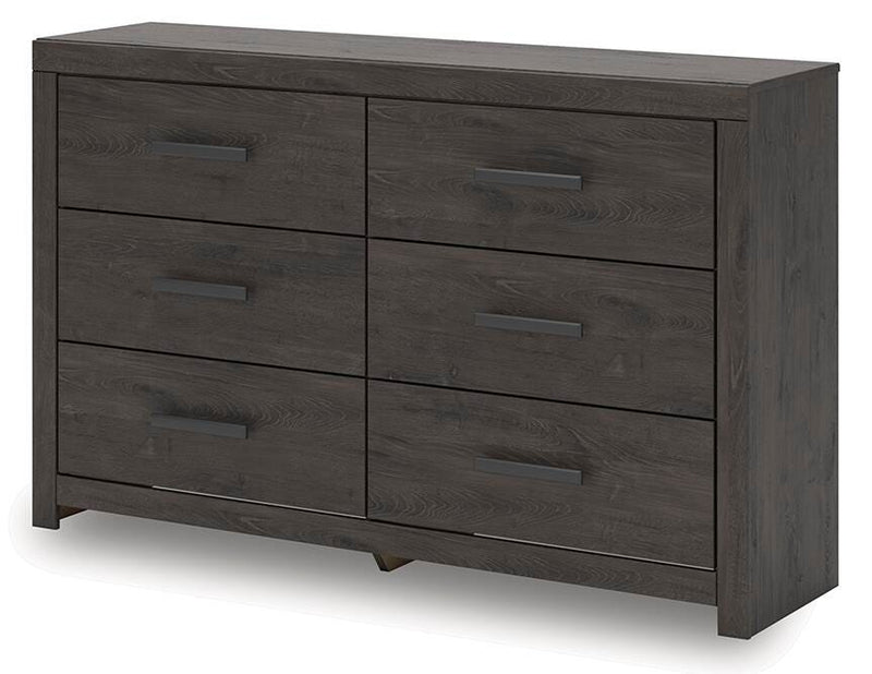 Ashley Furniture Prendonea dresser with a sleek, modern design, featuring multiple drawers and a warm wood finish.