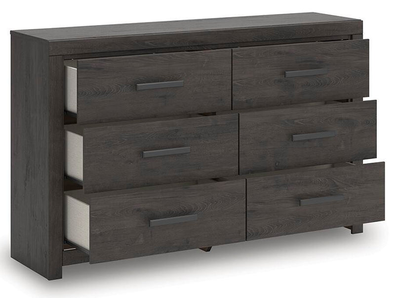 Ashley Furniture Prendonea Dresser with open drawers, showcasing spacious storage and modern design.