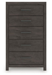 Ashley Furniture Prendonea chest of drawers showing a sleek wooden chest with multiple drawers and modern design.