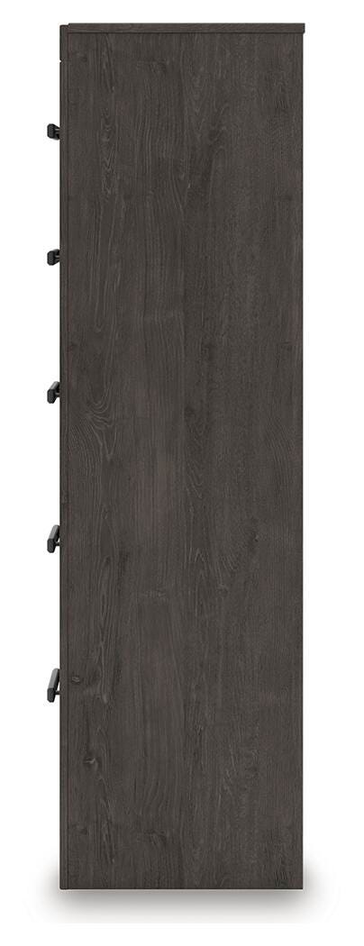 Ashley Furniture Prendonea chest of drawers with a sleek wooden finish and multiple storage drawers on a white background.