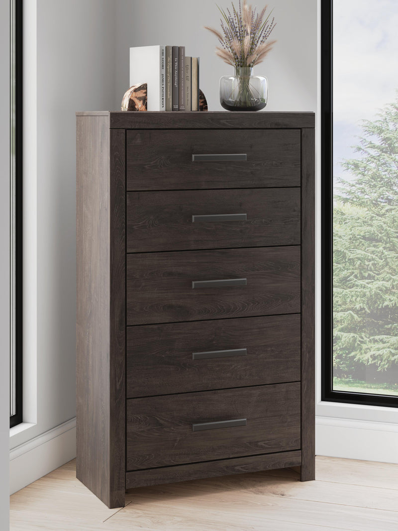 Ashley Furniture Prendonea chest of drawers, wooden storage unit with multiple drawers and modern design.
