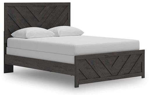 Ashley Furniture Prendonea Bed with elegant design, shown from an angled view highlighting the headboard and wood finish.