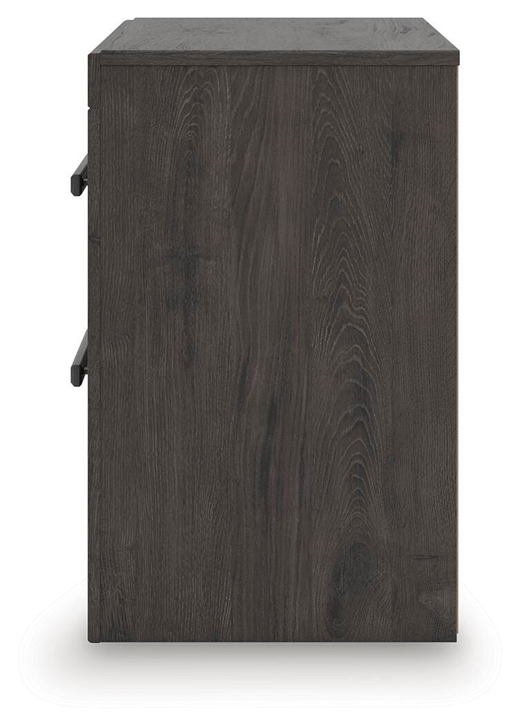 Ashley Furniture Prendonea nightstand with a sleek wood finish and modern design, featuring a drawer and open shelf for storage.