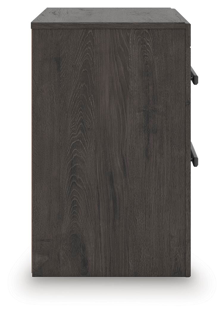 Ashley Furniture Prendonea nightstand with a dark wood finish and sleek modern design, featuring a single drawer and open shelf.