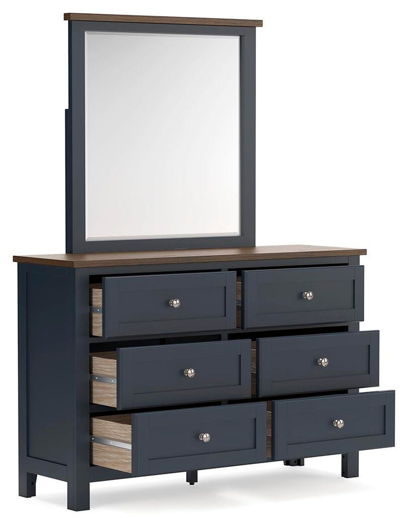 Ashley Furniture Landocken bedroom set featuring a bed, nightstands, and dresser in a modern bedroom interior.