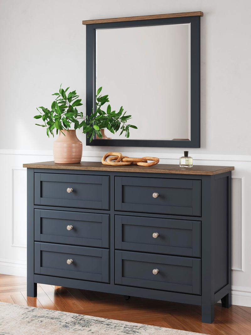 Ashley Furniture Landocken bedroom set featuring a bed, dresser, and nightstands in a modern bedroom design.