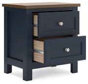 Ashley Furniture Landocken Bedroom Set with open view of bed, dresser, and nightstands in a modern bedroom design.