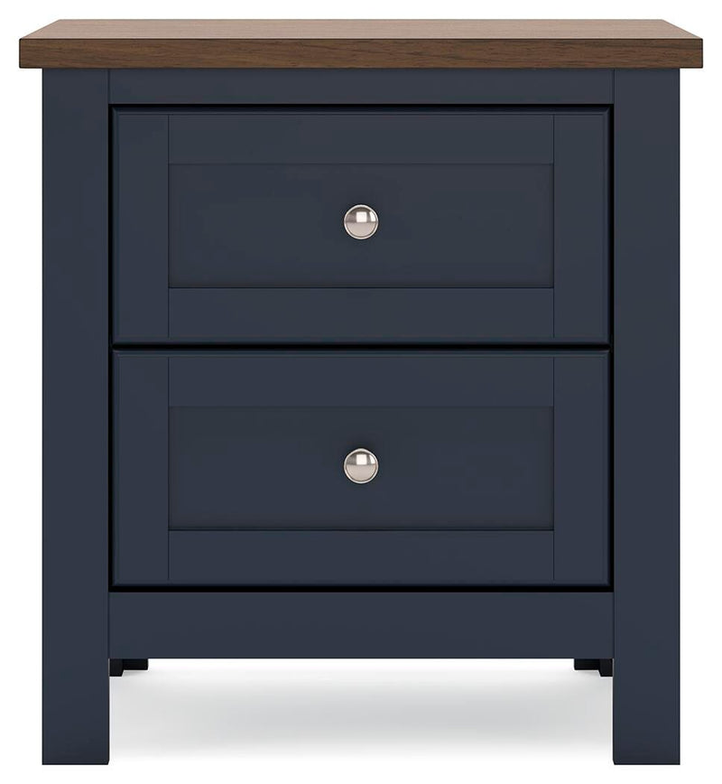 Ashley Furniture Landocken bedroom set with headboard, pillows, and bedding in a cozy bedroom scene.