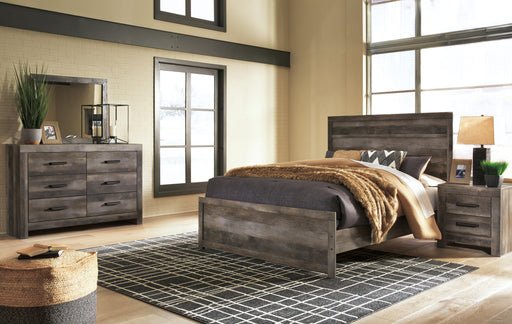 Ashley Furniture Wynnlow bedroom set with a stylish bed frame, matching nightstands, and modern bedroom furniture in a cozy setting.