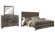 Ashley Furniture Wynnlow bedroom set with a stylish bed, nightstands, and dresser in a modern bedroom design.
