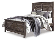 Ashley Furniture Wynnlow bedroom set featuring a bed, dresser, and nightstands in a stylish, cohesive bedroom design.